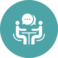 Two people talking at a table icon.